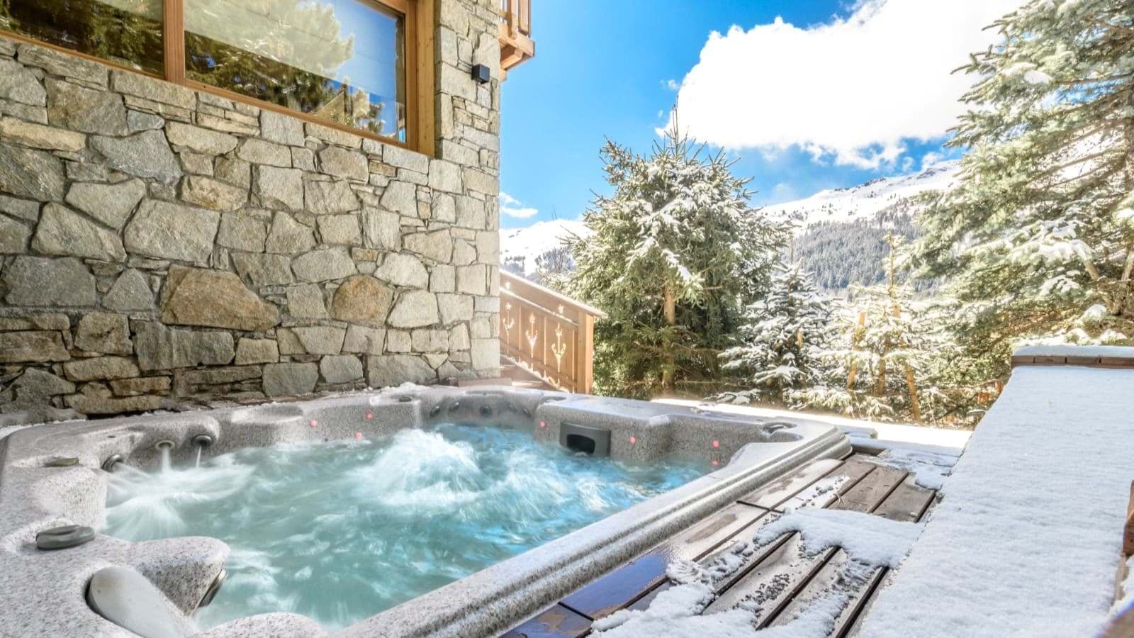Outdoor hot tub seats 6 with snowy mountain views