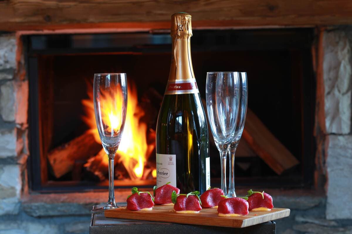 Wood-burning fireplace with natural stone surround