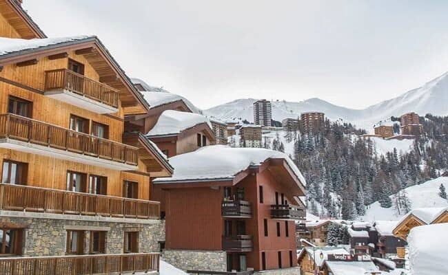 Ski-in/ski-out chalet exterior with private balconies and mountain views