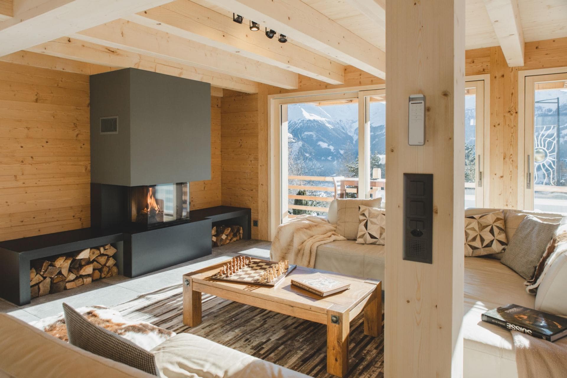 Living area with wood-burning fireplace and mountain valley views