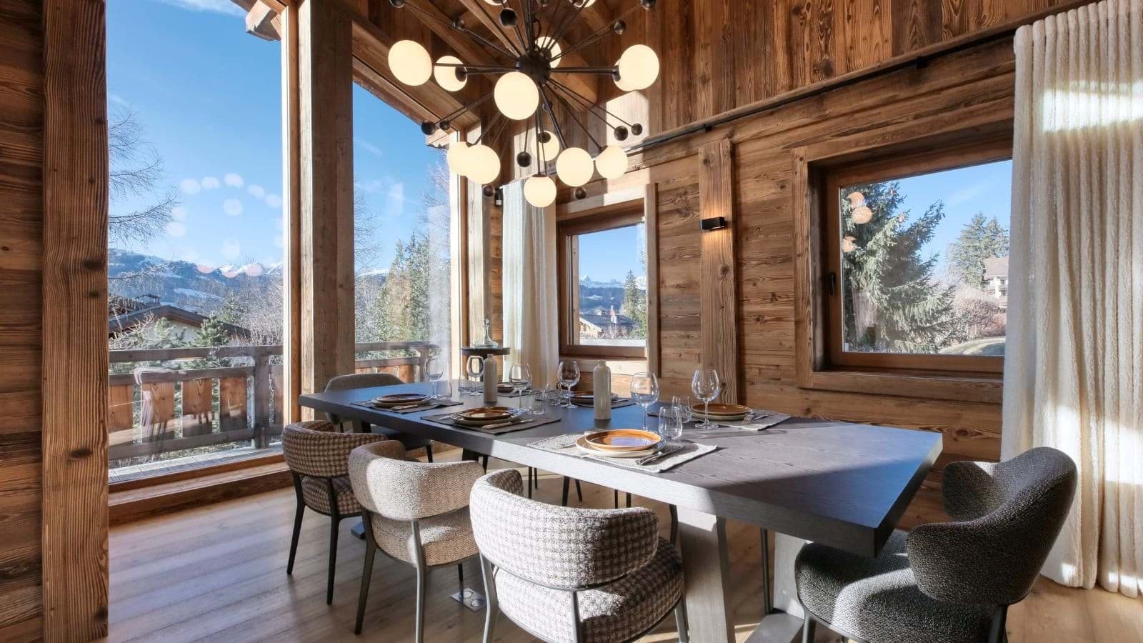 Dining area seats 8; mountain views through floor-to-ceiling windows