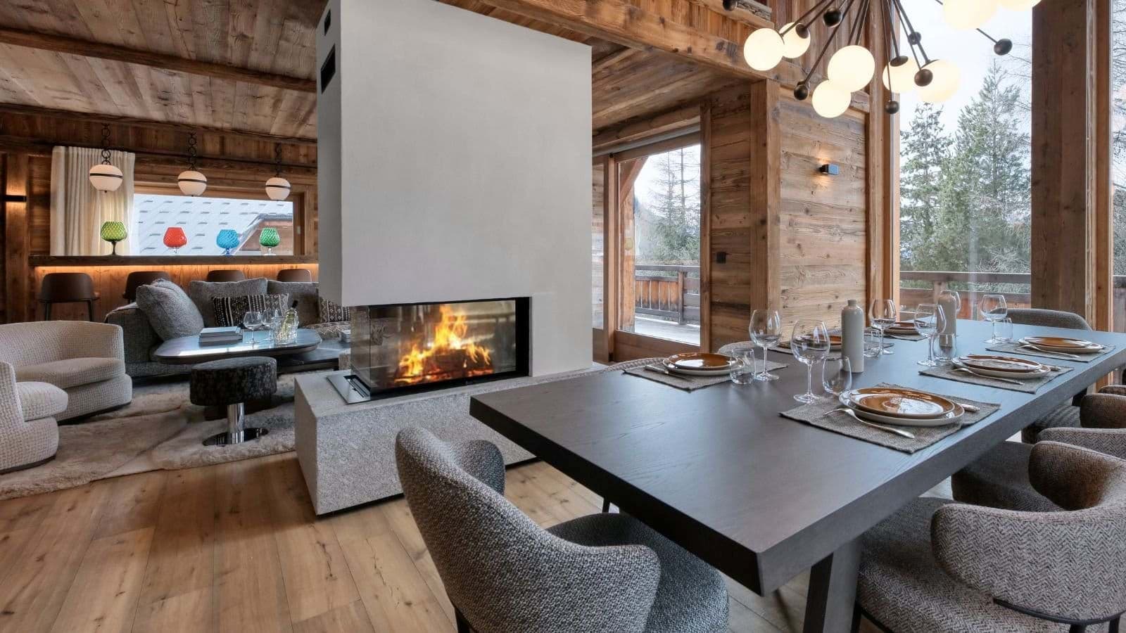 Dining area with seating for 10 and three-sided glass fireplace