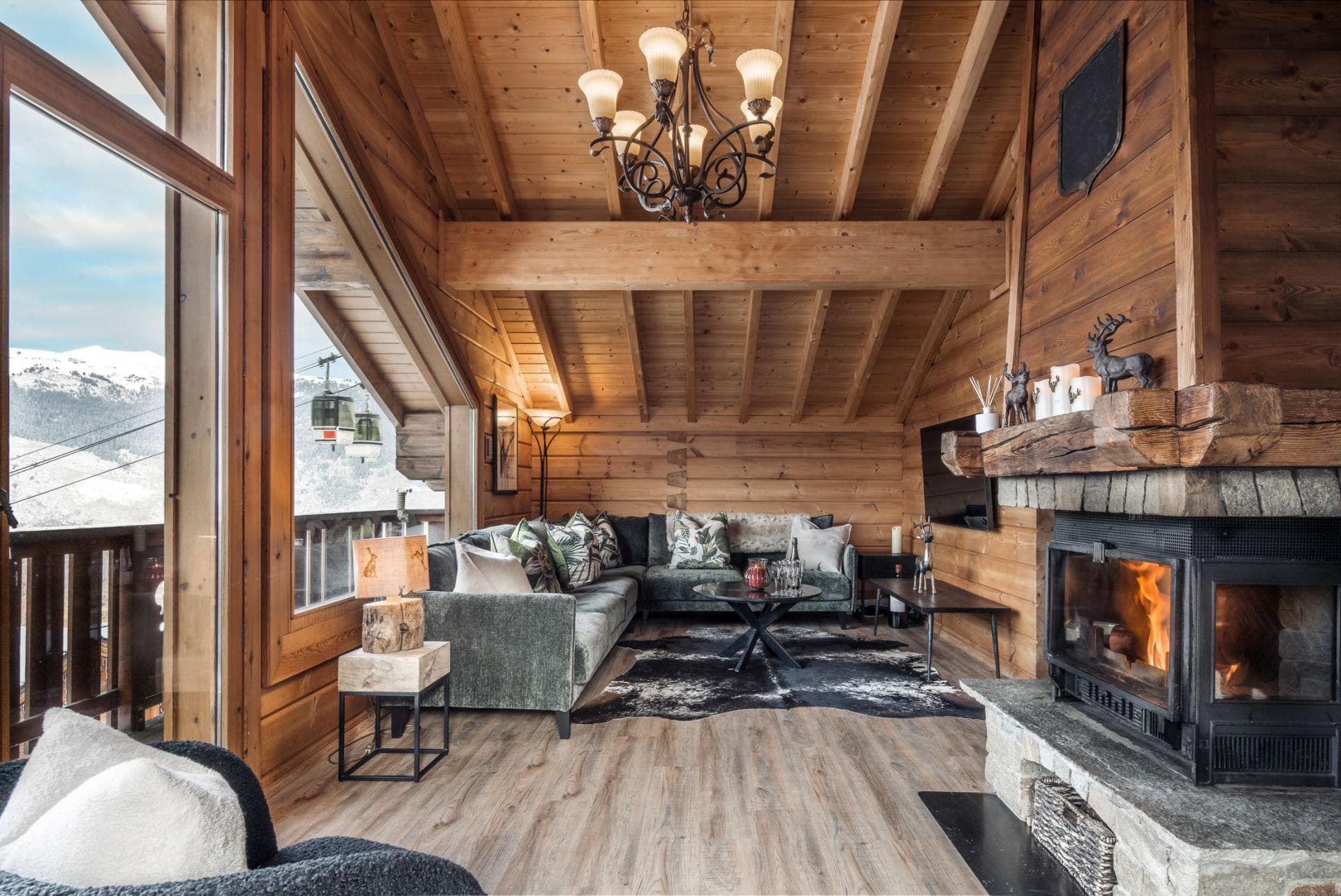 Living area with wood-burning fireplace and gondola views