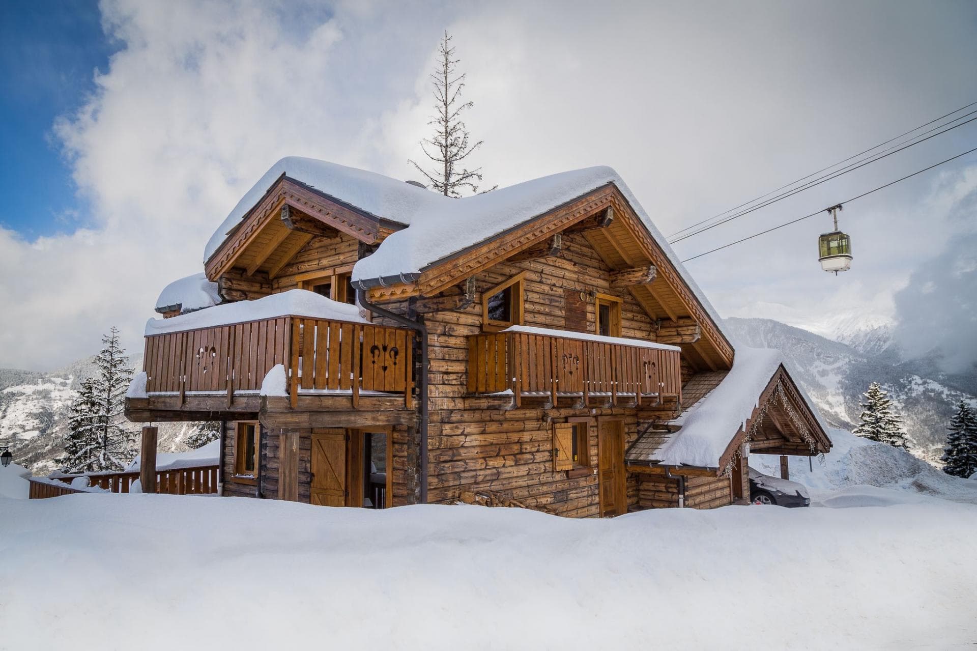 Ski-in/ski-out log chalet located directly beneath the gondola line
