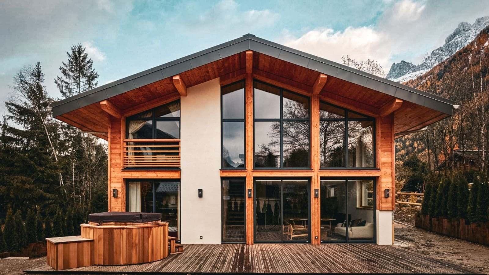 Chalet exterior with cedar hot tub and mountain views