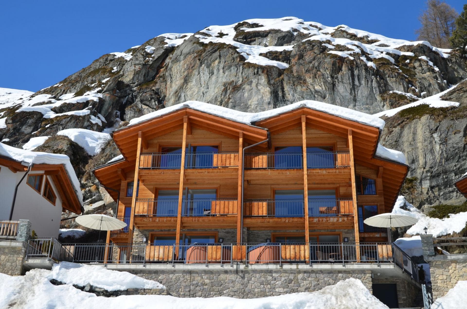 Ski-in/ski-out chalet with private balconies and ground-floor hot tubs