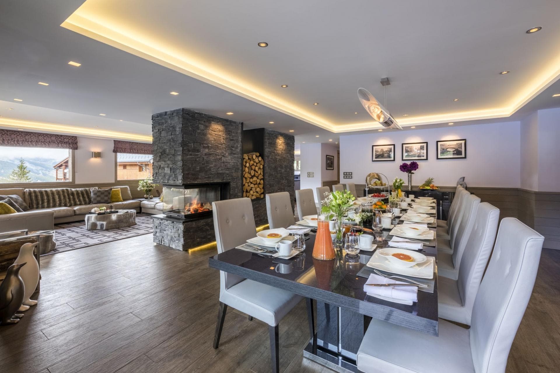 Open living area with dining for 12 and double-sided fireplace