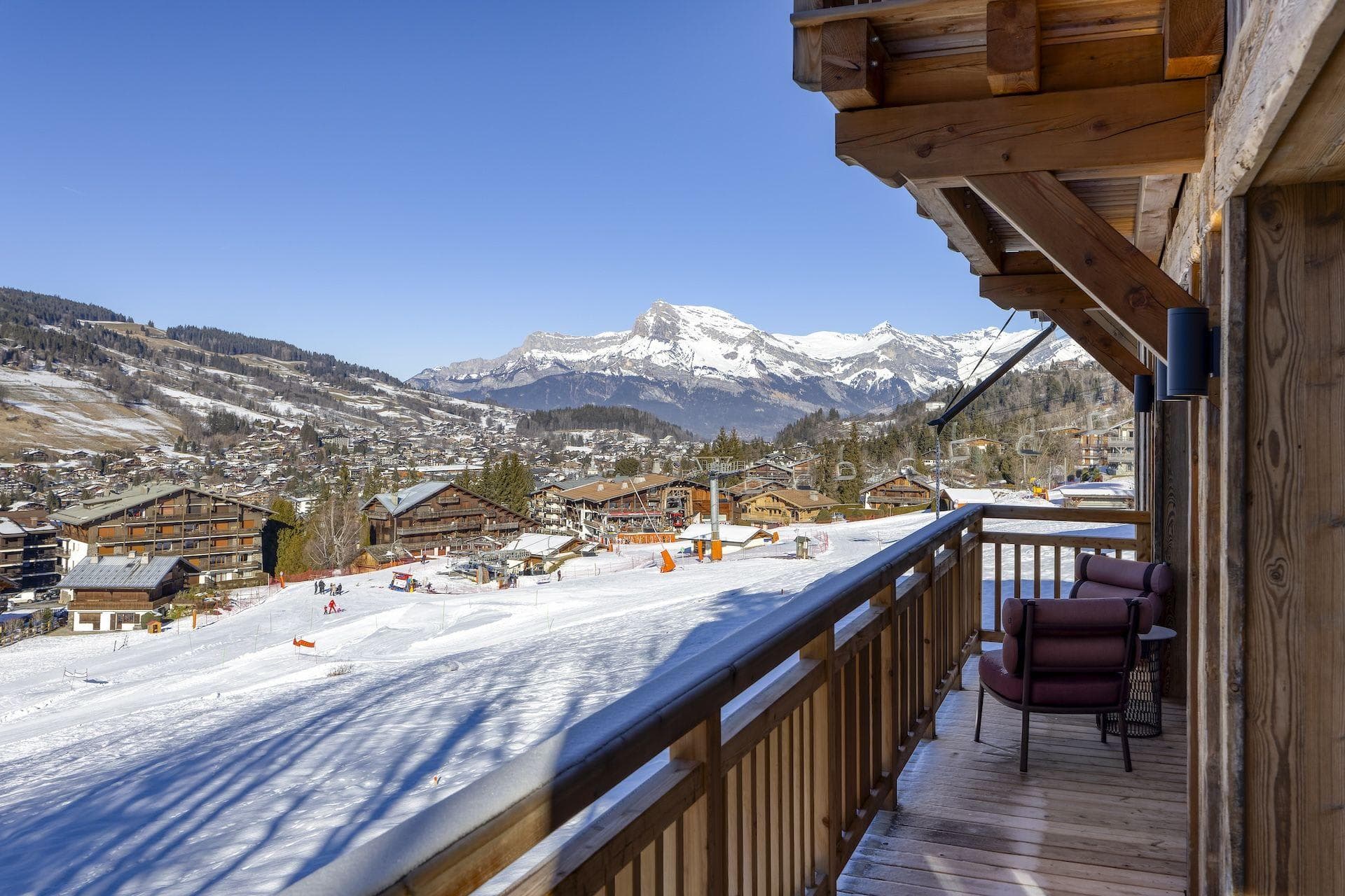 Private balcony with mountain views and direct ski-in/ski-out access