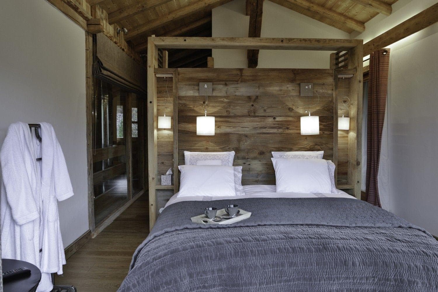 Primary bedroom with king bed and reclaimed wood headboard