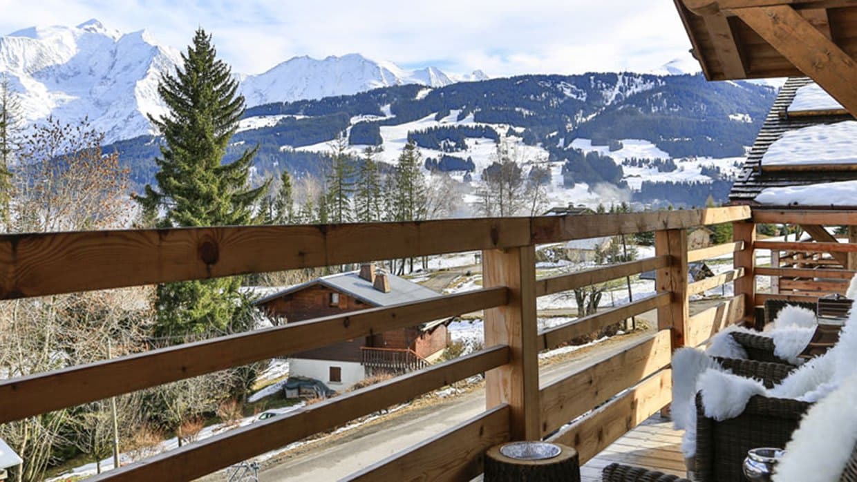 Private balcony with mountain views and faux-fur seating