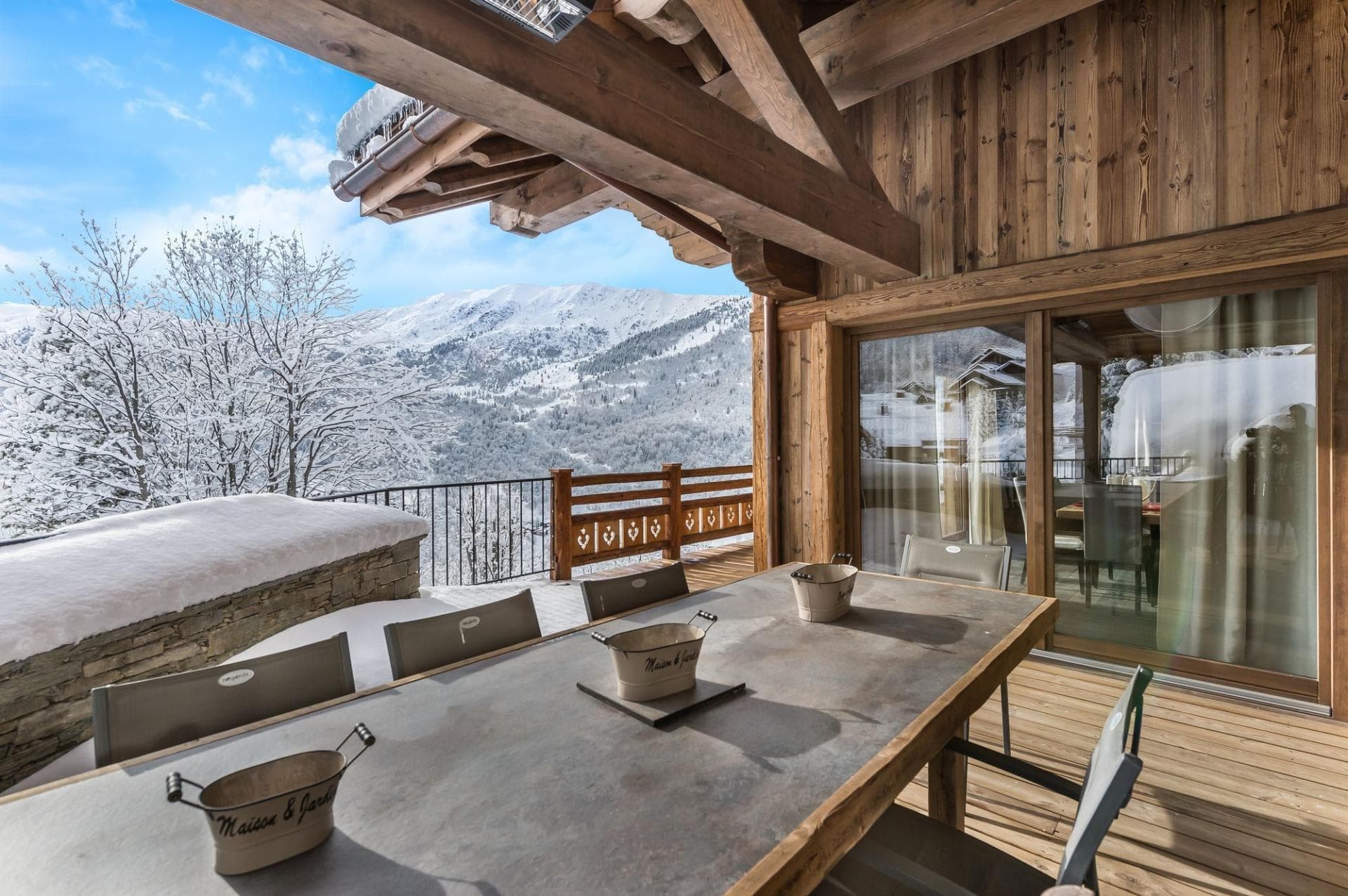 Covered terrace seats 8 with overhead heating and mountain views