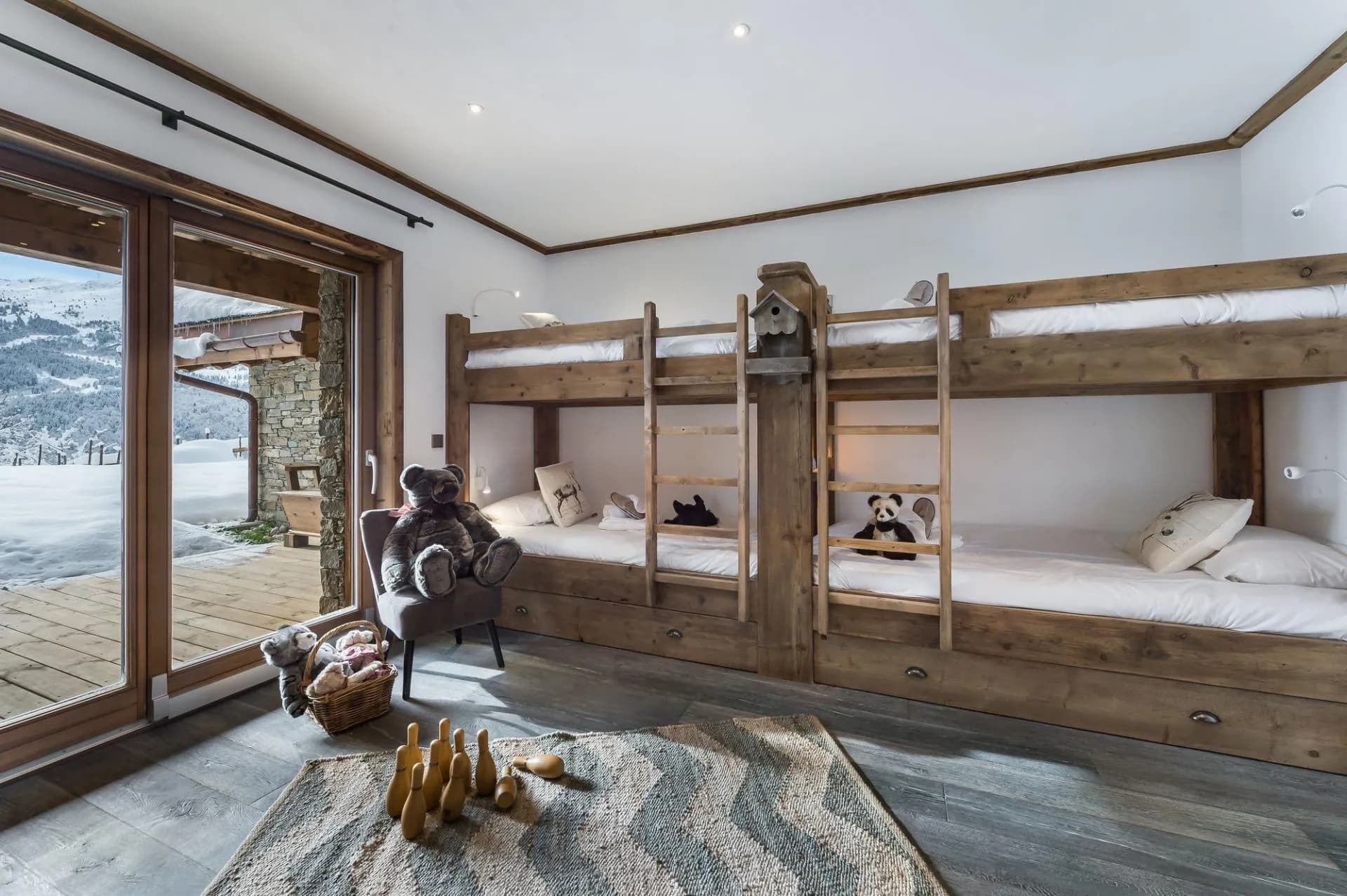 Children's bedroom with two bunk beds and terrace access