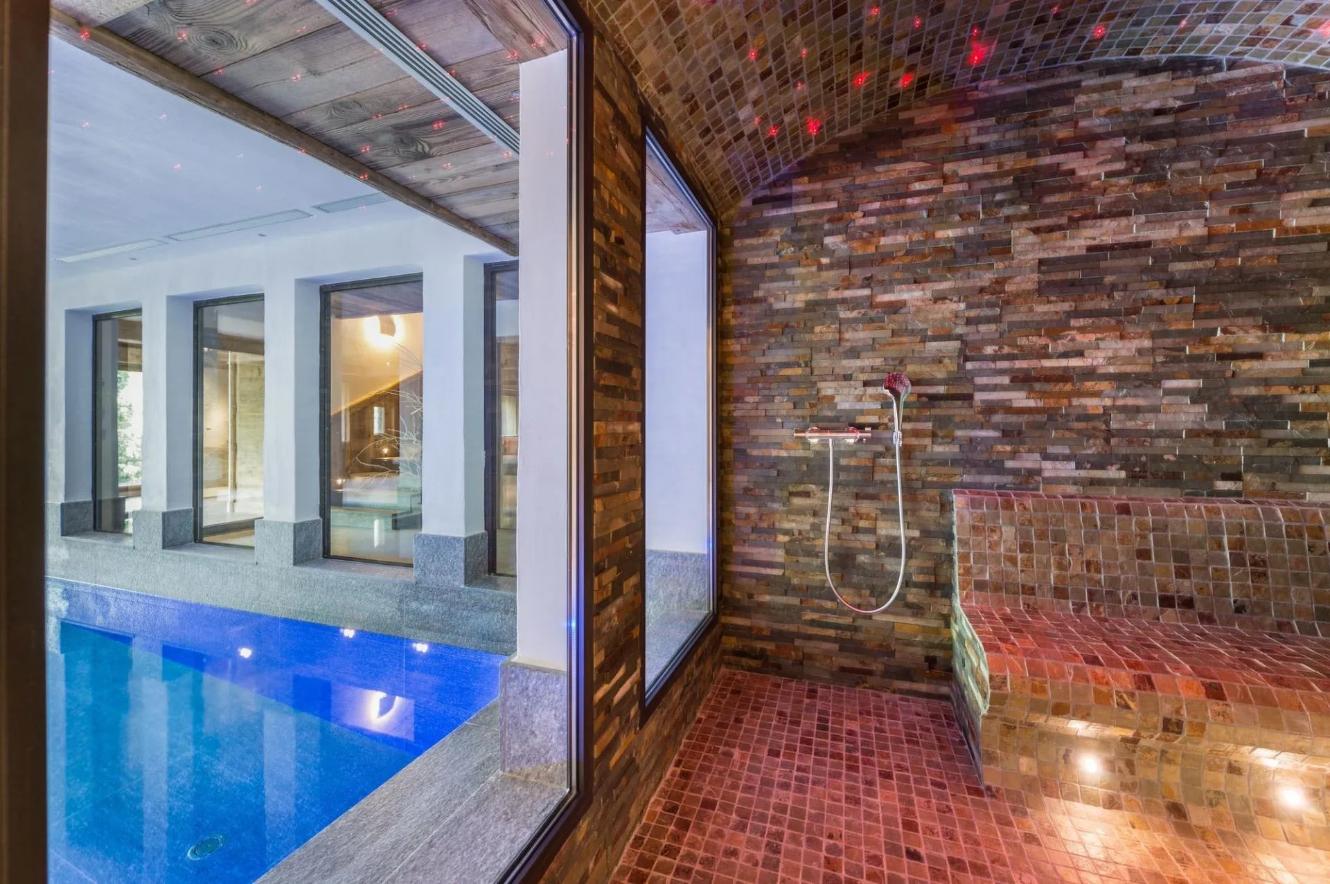 Stone hammam with fibre-optic lighting beside the indoor pool