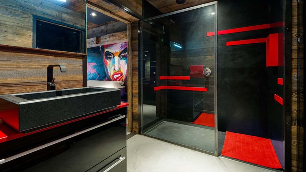 En suite bathroom with stone trough sink and walk-in rainfall shower