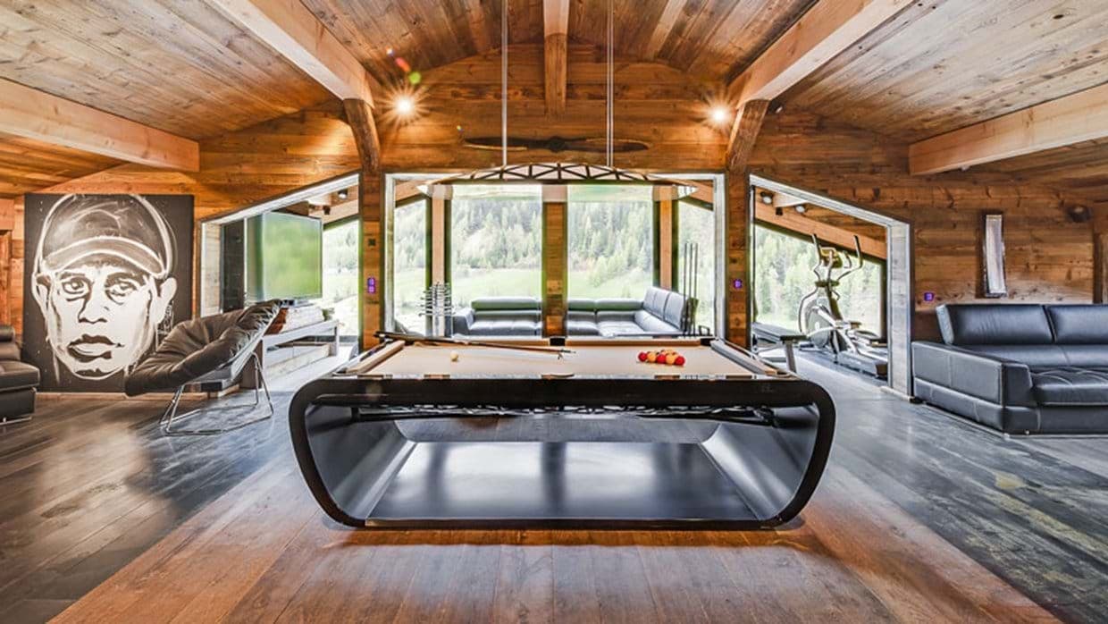 Game room with billiards table, media lounge, and gym equipment