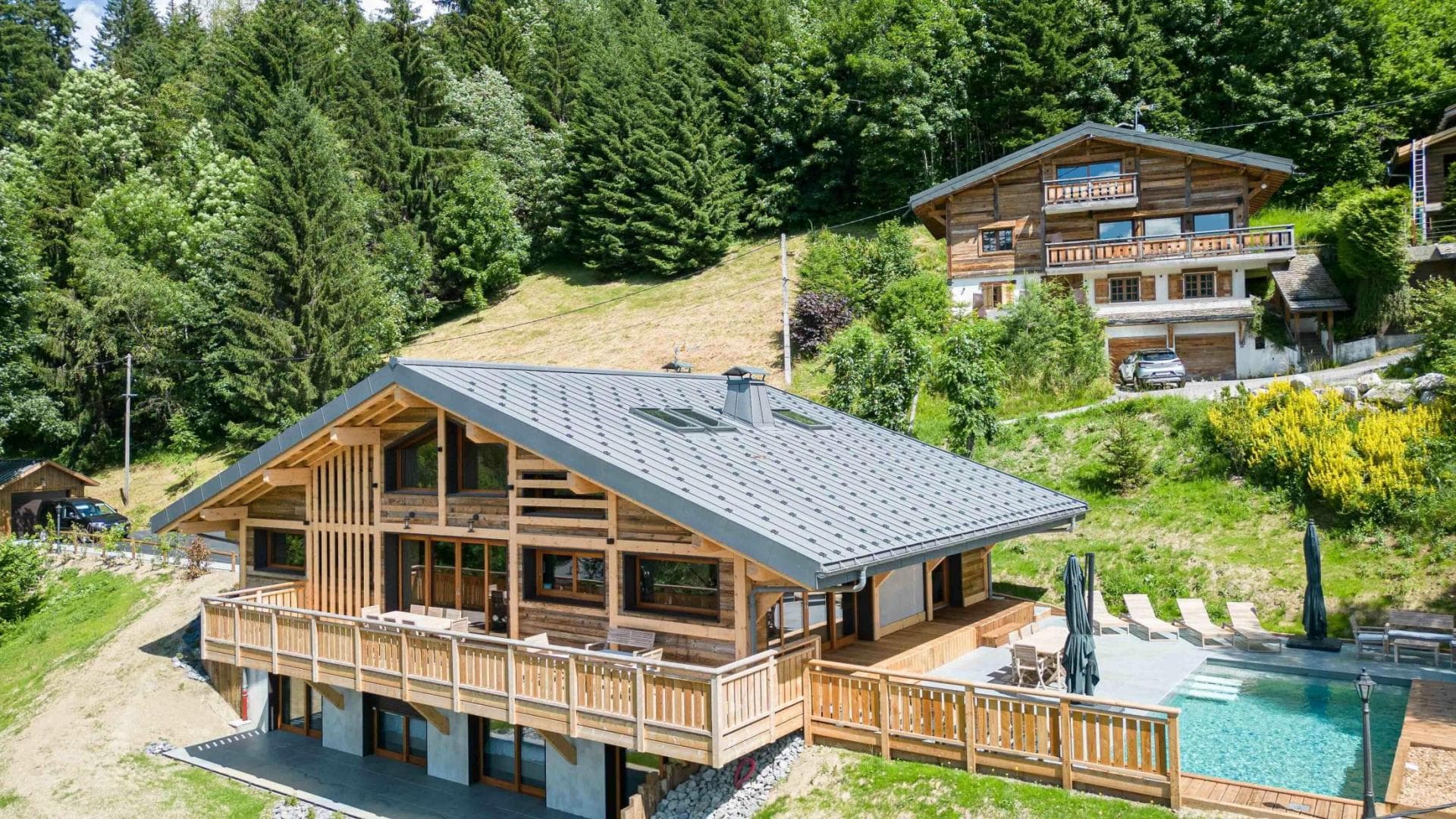 Chalet exterior with wrap-around balcony and private outdoor pool