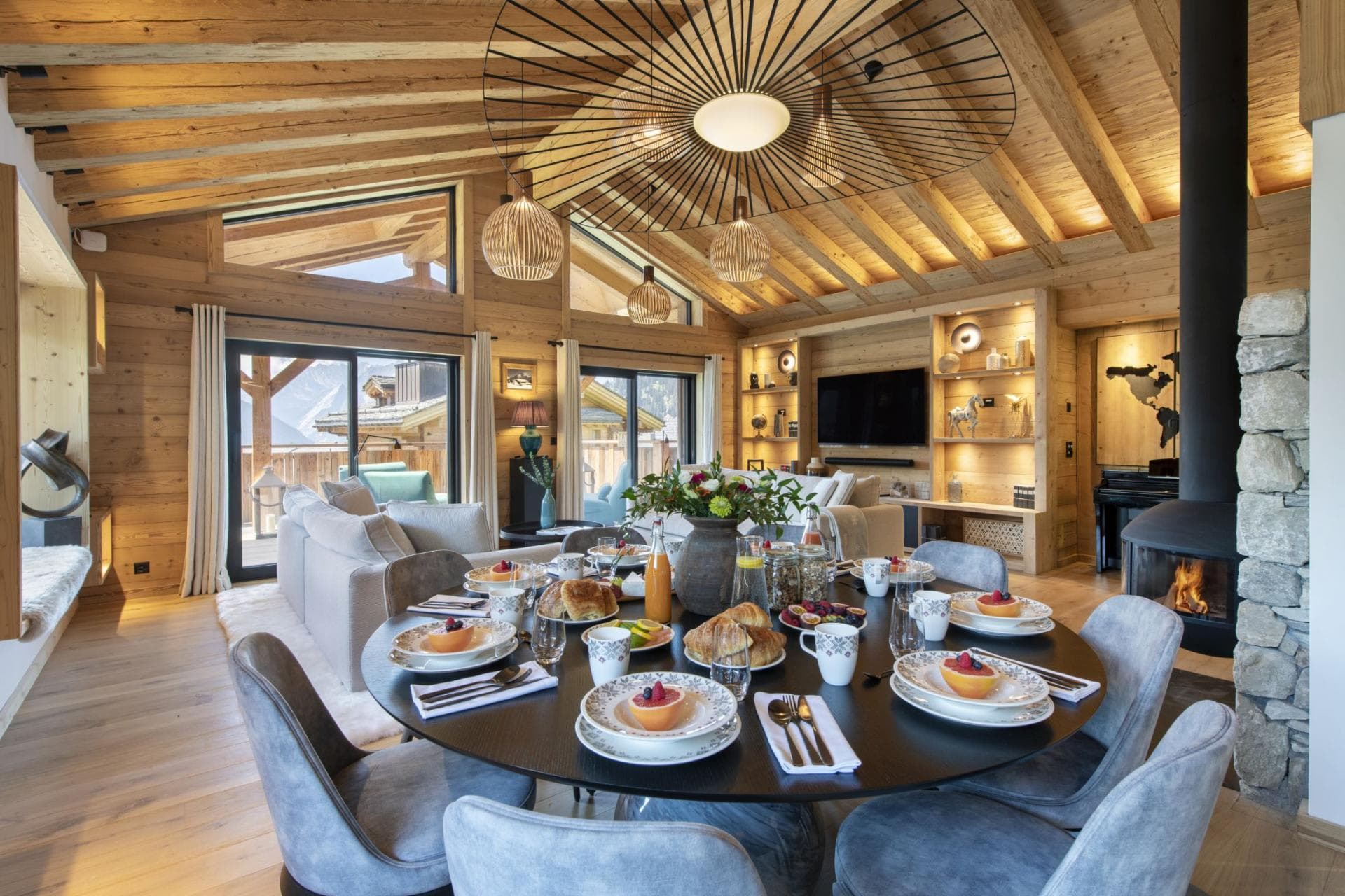 Open-plan dining area with seating for 8; wood-burning fireplace