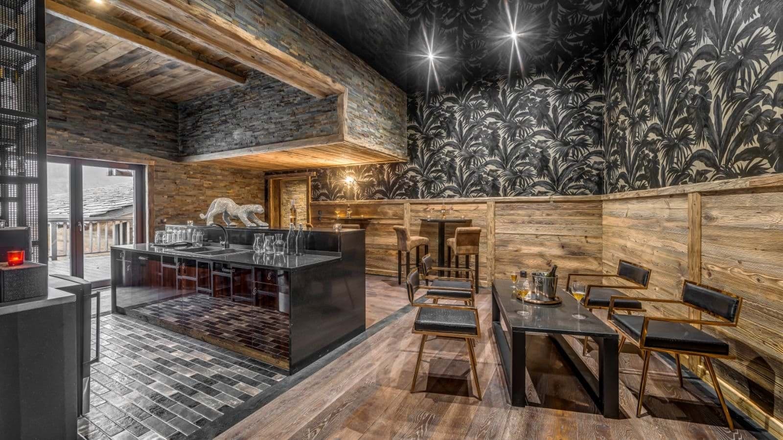 Lower level bar and lounge with wet bar and terrace access