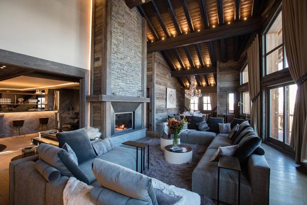 Living area with wood-burning fireplace and sectional seating for 10