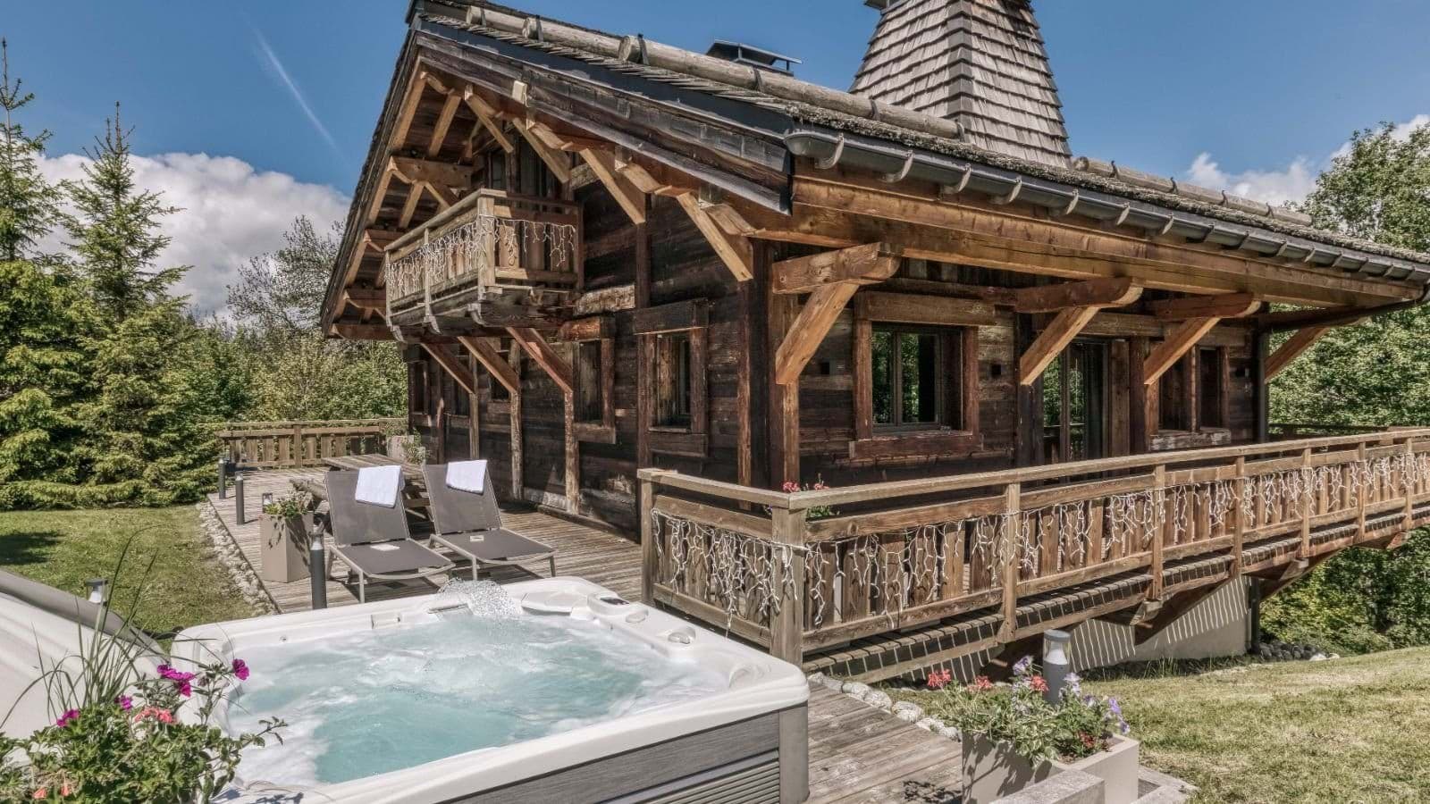 Chalet deck with jetted hot tub and sun loungers