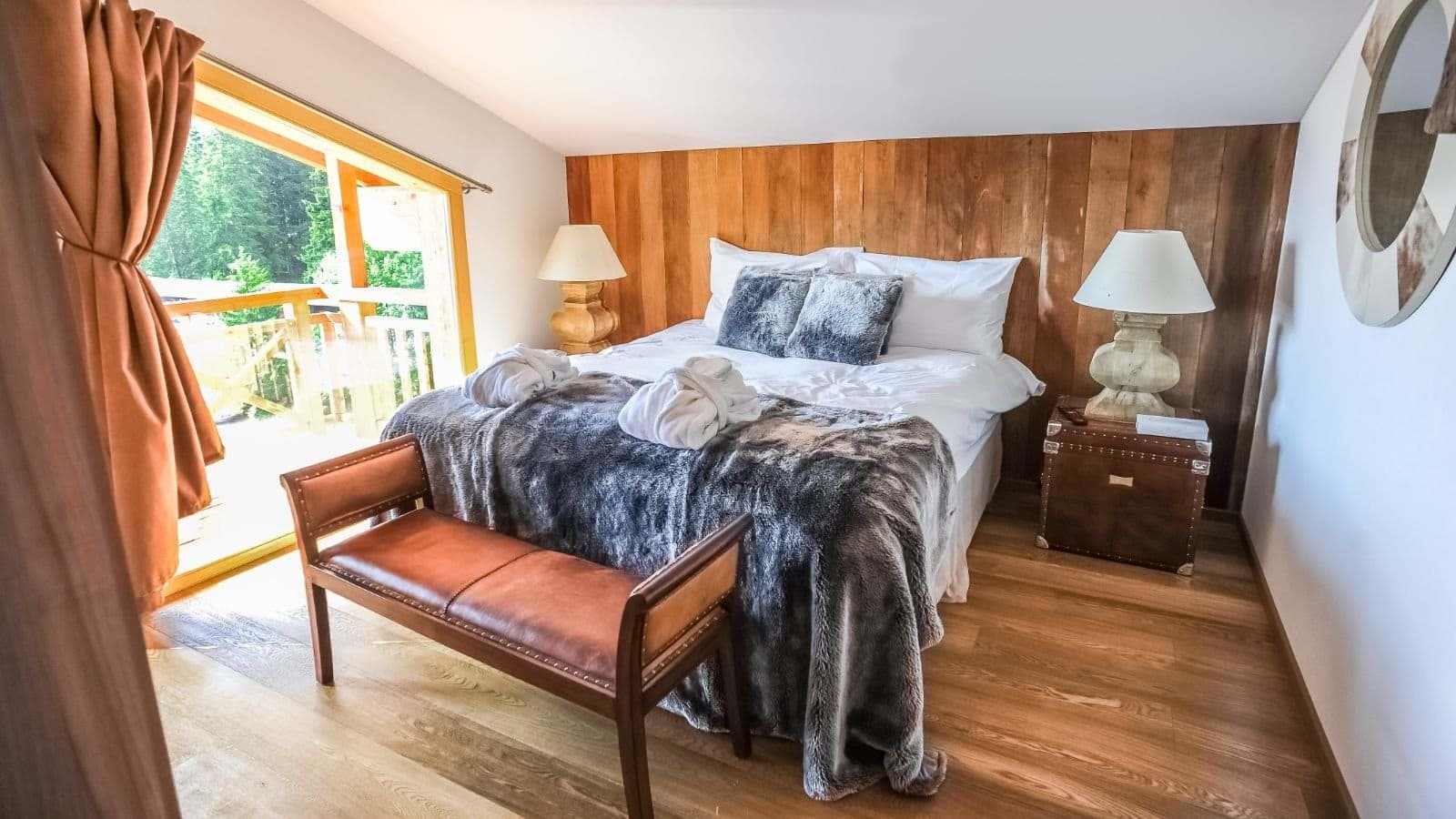 Primary bedroom with king bed and private balcony access