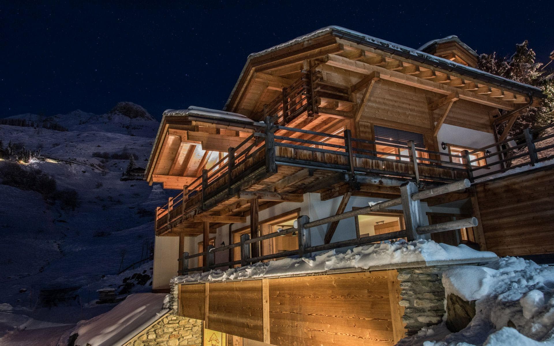 Ski-in/ski-out chalet exterior with multi-level wraparound balconies