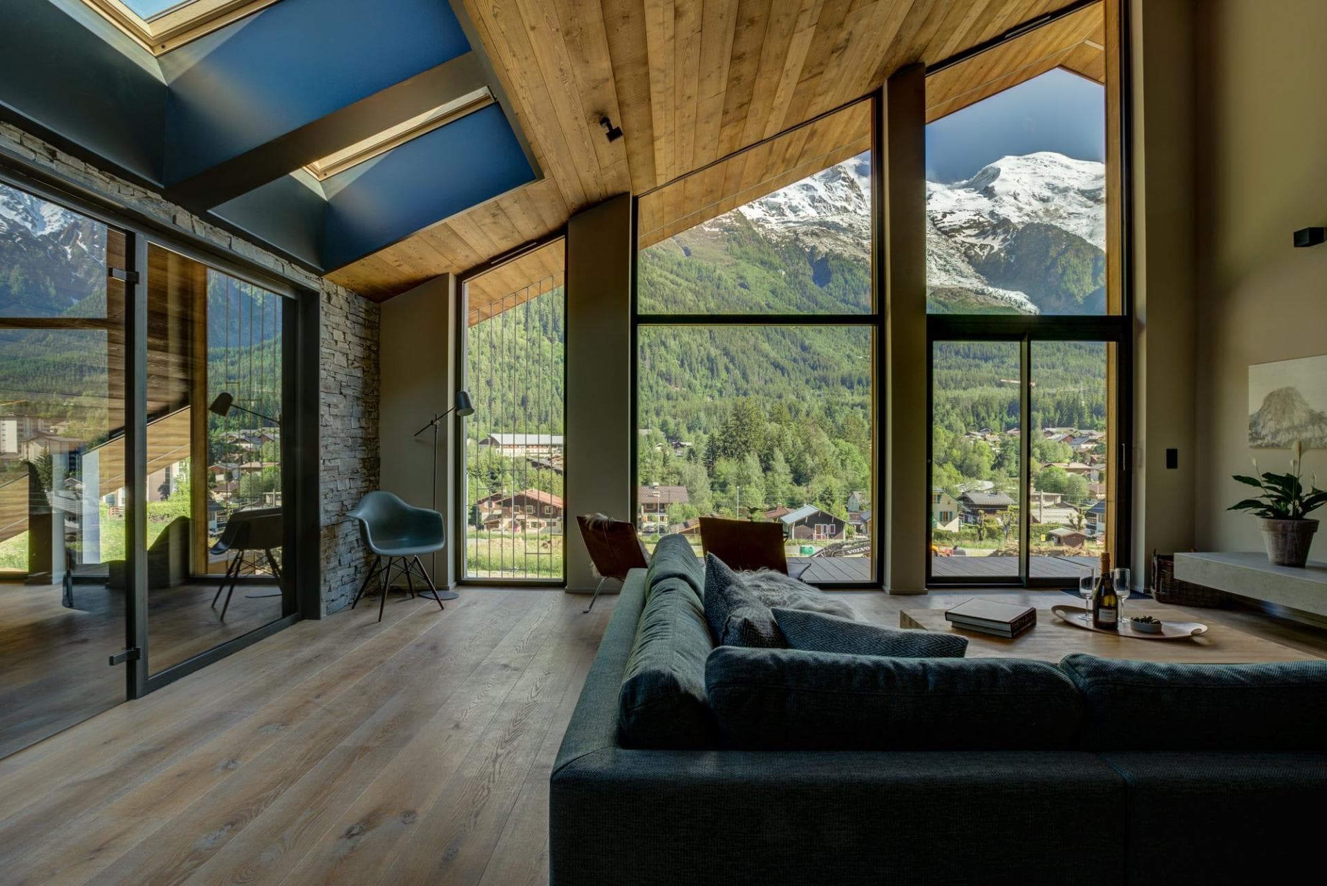 Living area with floor-to-ceiling windows and Mont Blanc massif views