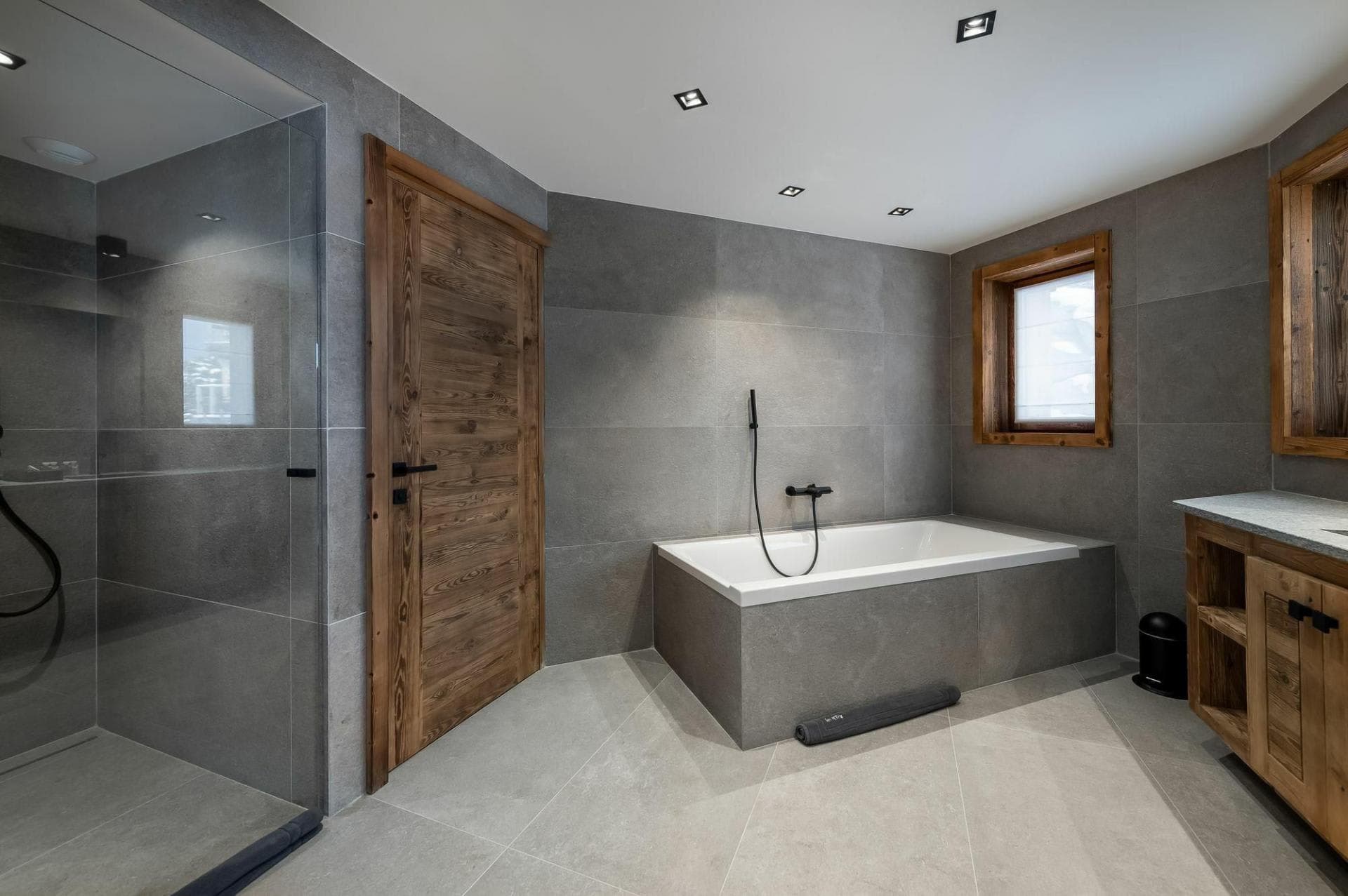 Bathroom with walk-in shower and separate tiled soaking tub