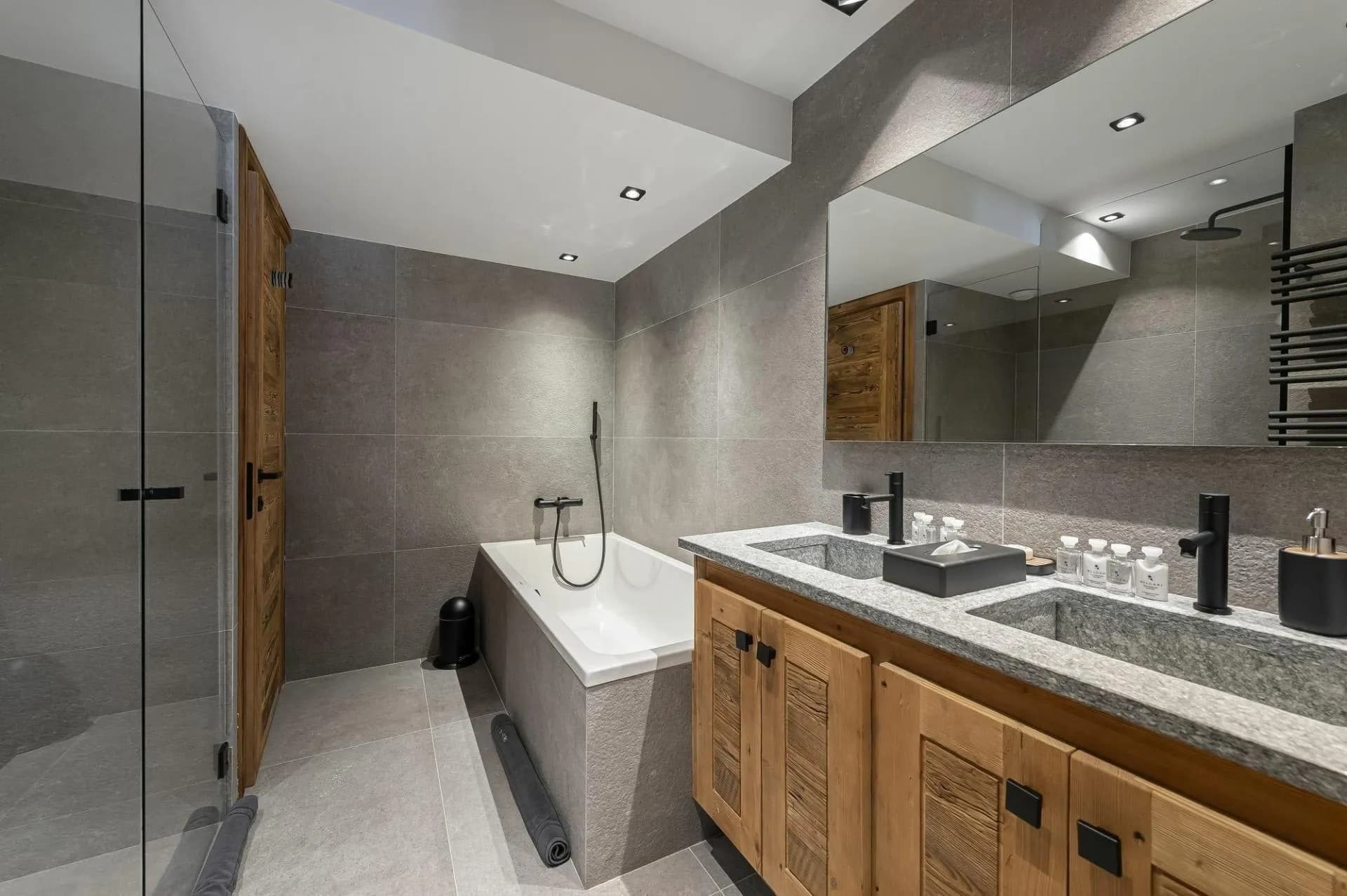Bathroom with bathtub, shower and double basins