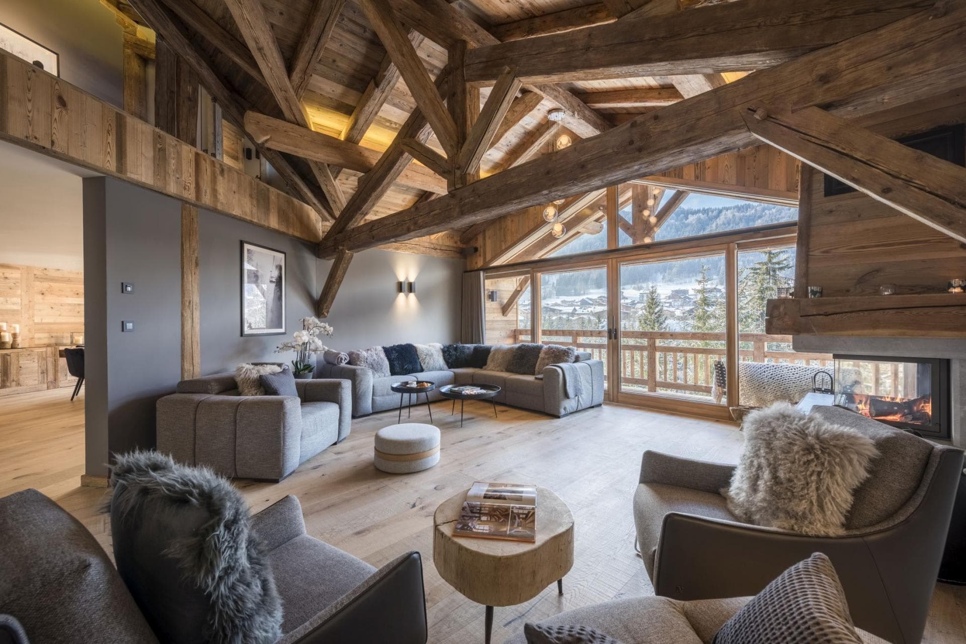 Living area with wood-burning fireplace and mountain valley views