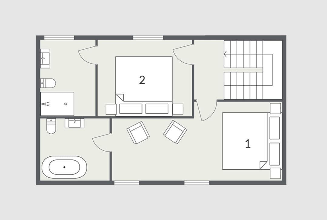 Upper floor plan: two bedrooms and two bathrooms including soaking tub