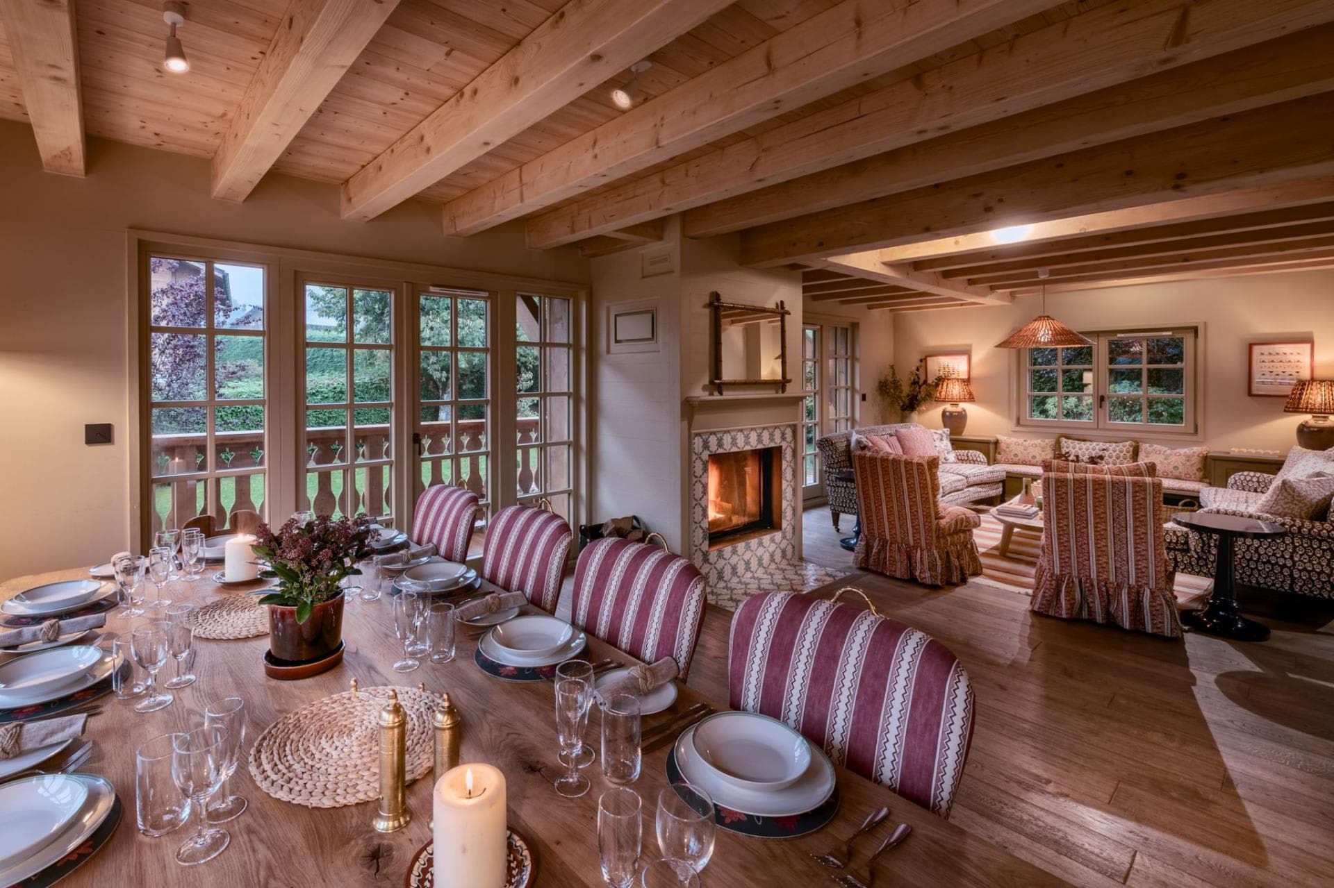 Open-plan dining and living area with fireplace and terrace access