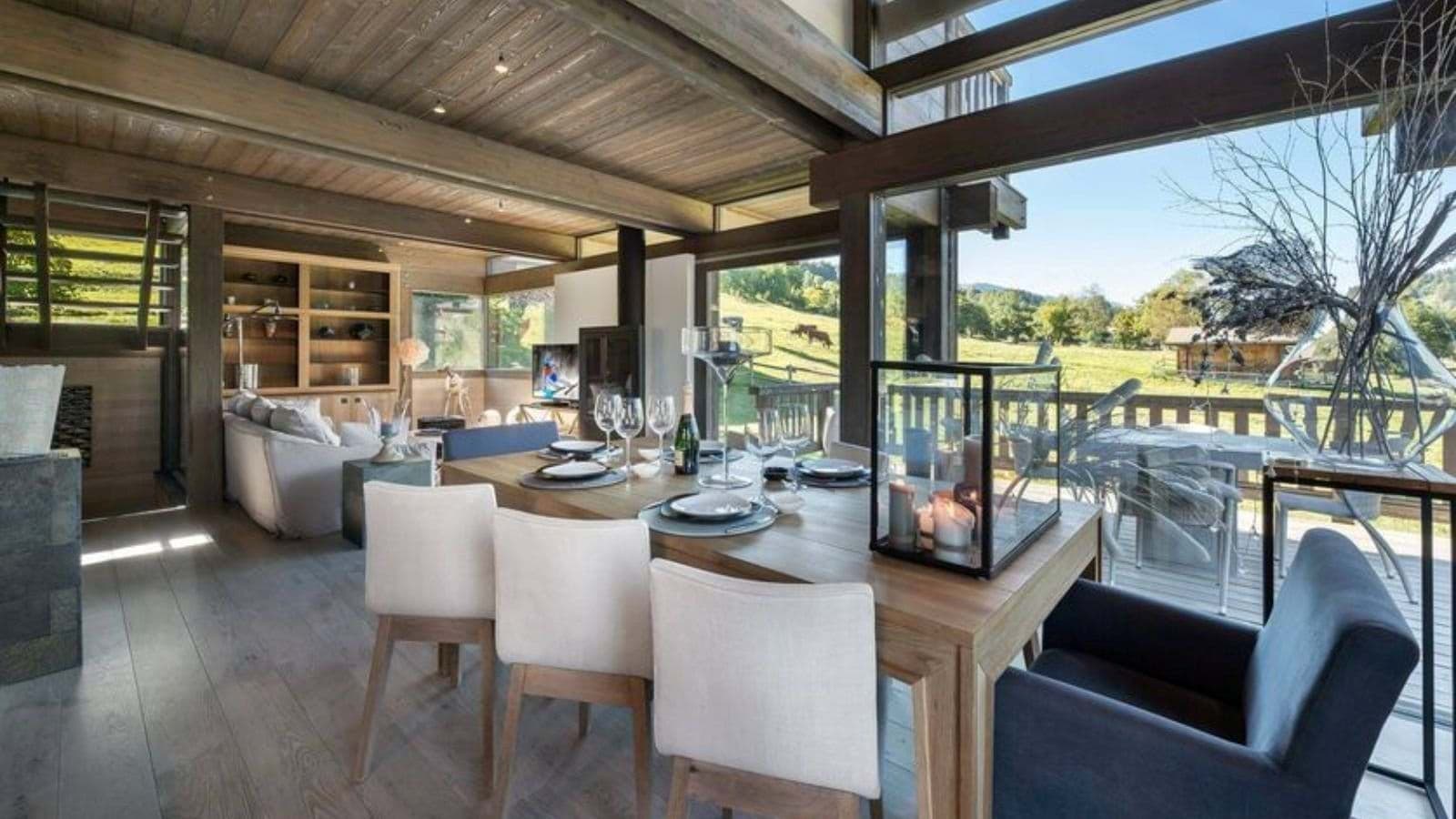 Open-plan dining area seating 8 with valley views and terrace access