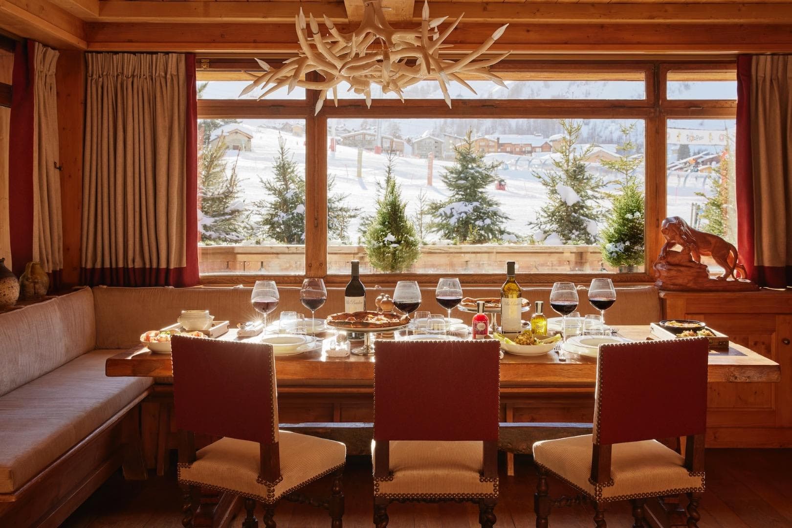 Dining area with banquette seating and ski-in/ski-out mountain views