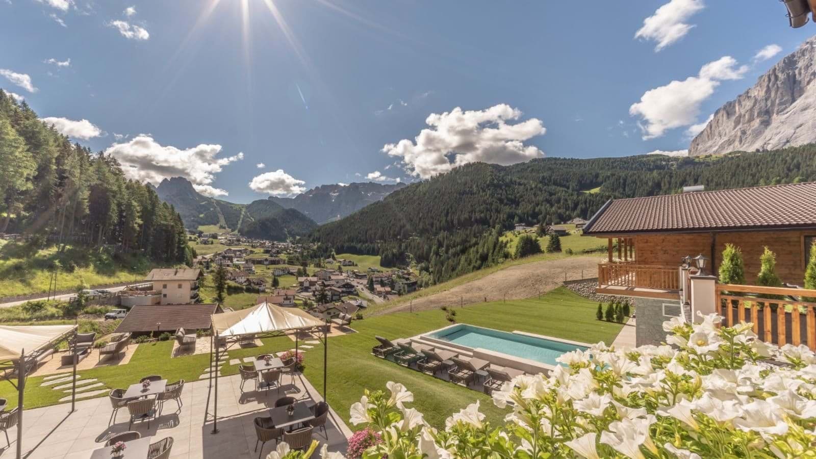 Terrace with outdoor dining, heated pool, and panoramic mountain valley views