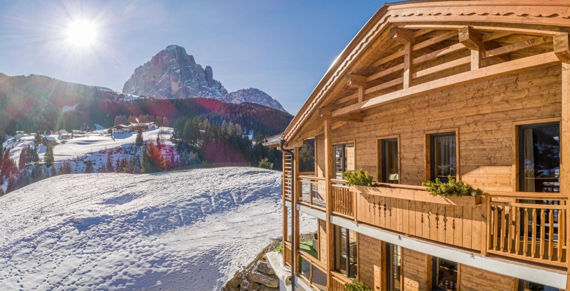 Chalet exterior featuring private balconies with panoramic Dolomites views