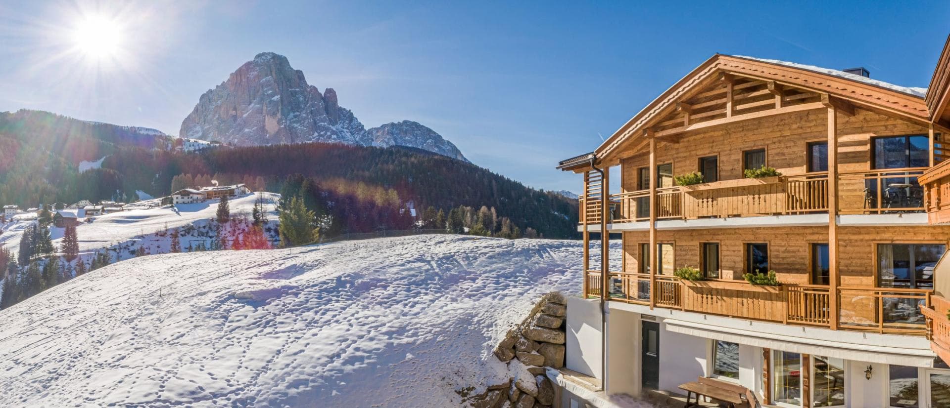 Chalet exterior with private balconies and direct mountain views