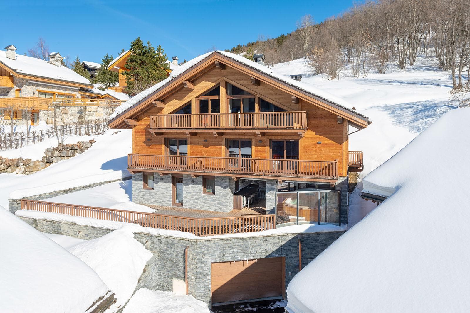 Ski-in/ski-out chalet with private garage and two levels of wrap-around balconies