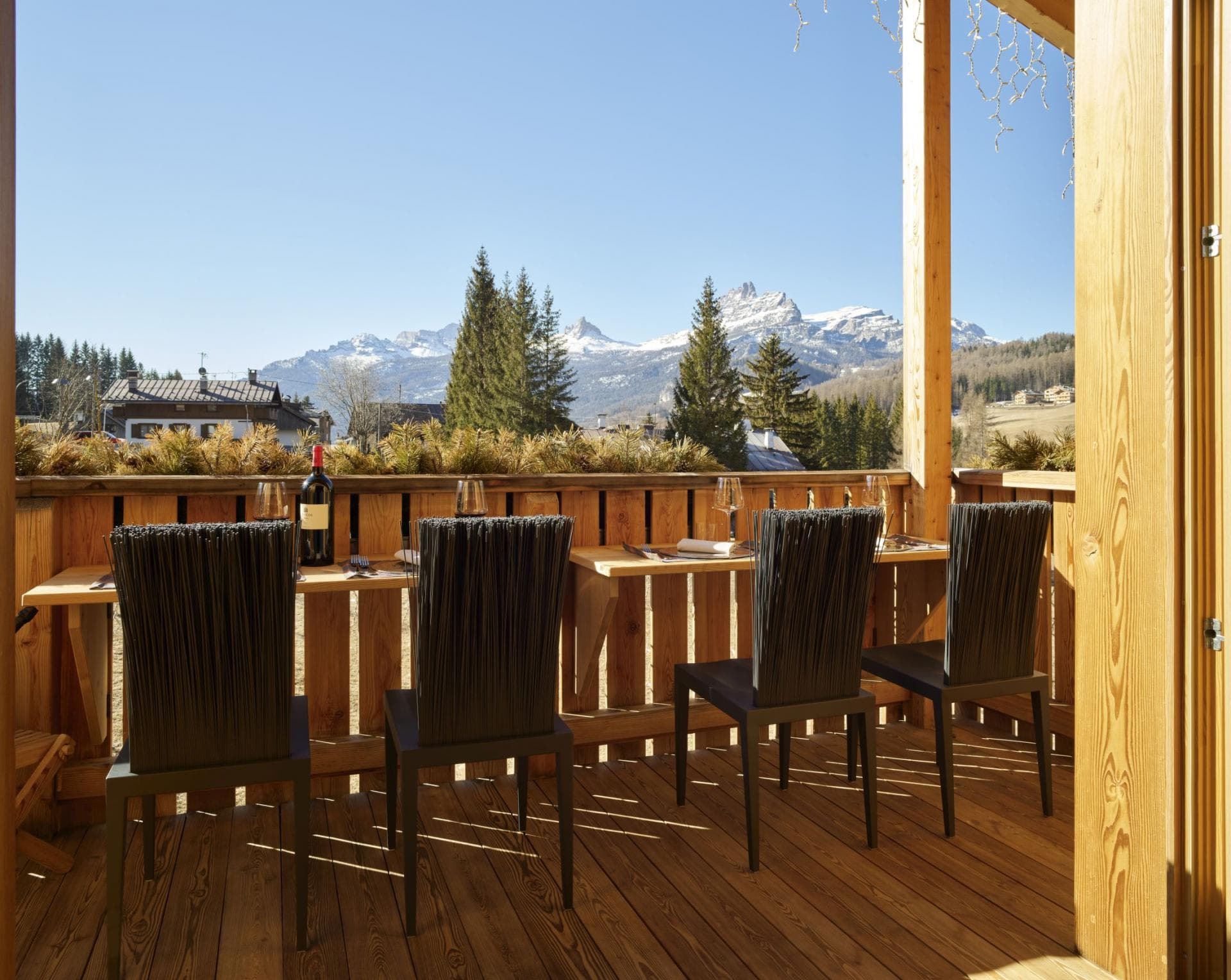 Covered balcony with dining for four and mountain peak views