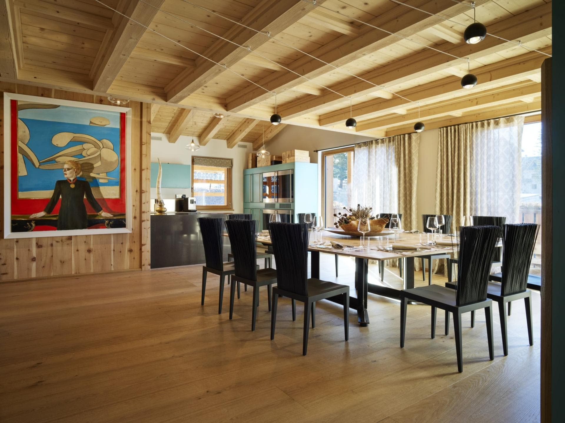 Dining area seats 10; features vaulted timber ceilings and track lighting