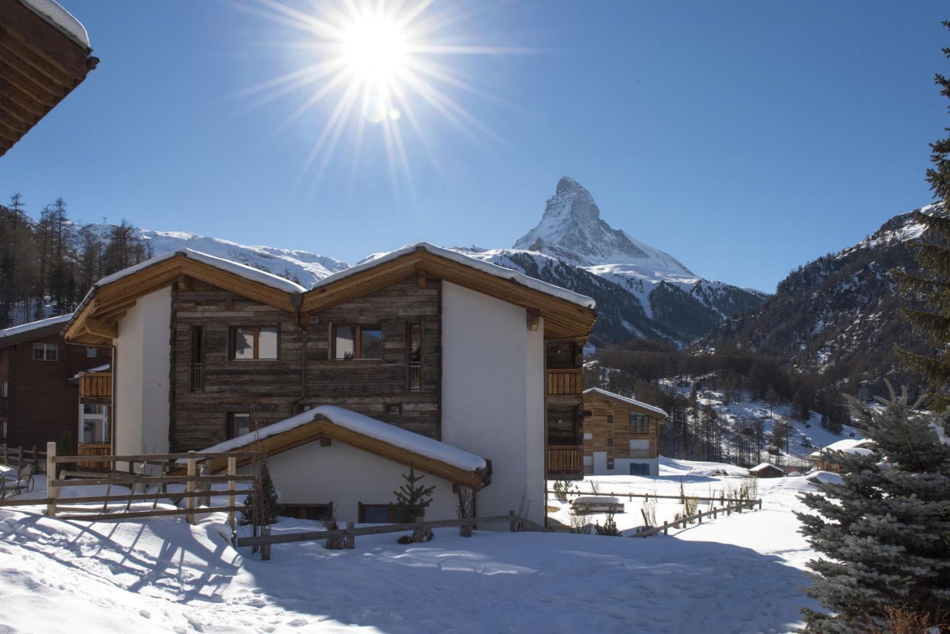 Chalet exterior with direct Matterhorn views and snow-covered grounds