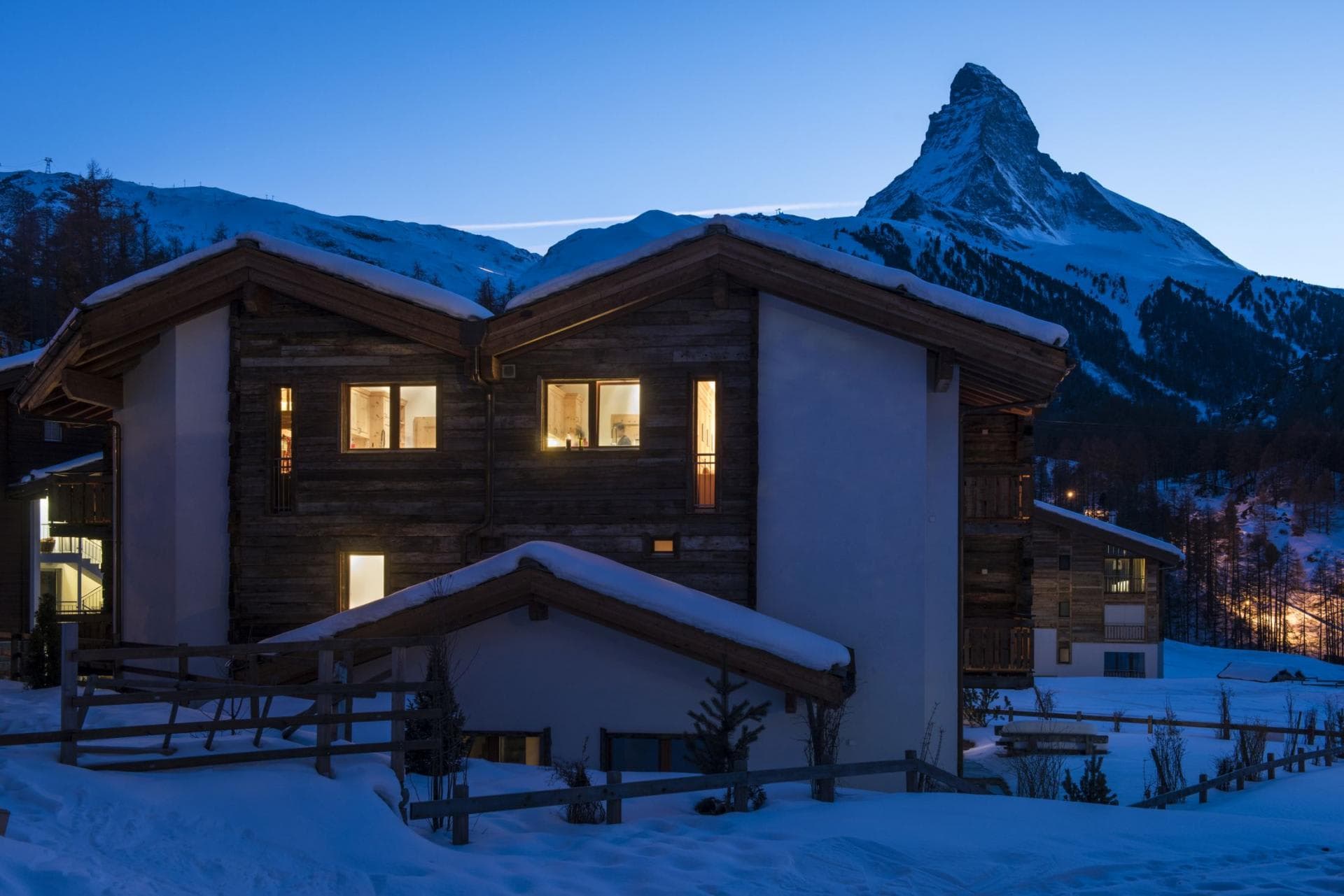 Chalet exterior at dusk with direct views of the Matterhorn