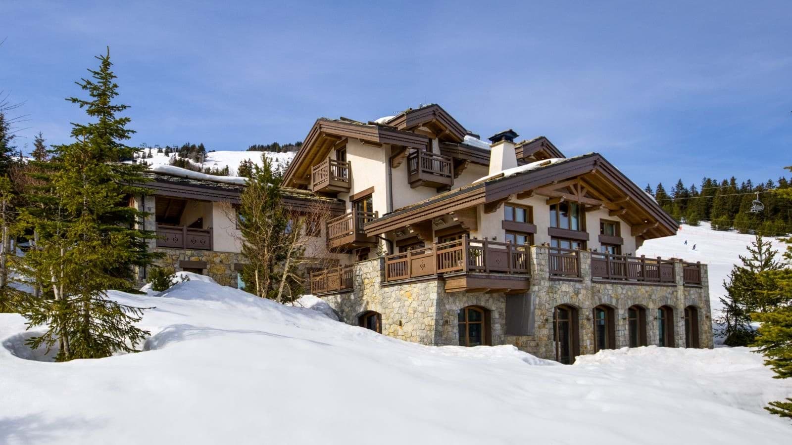 Ski-in, ski-out chalet with stone terrace and multiple private balconies