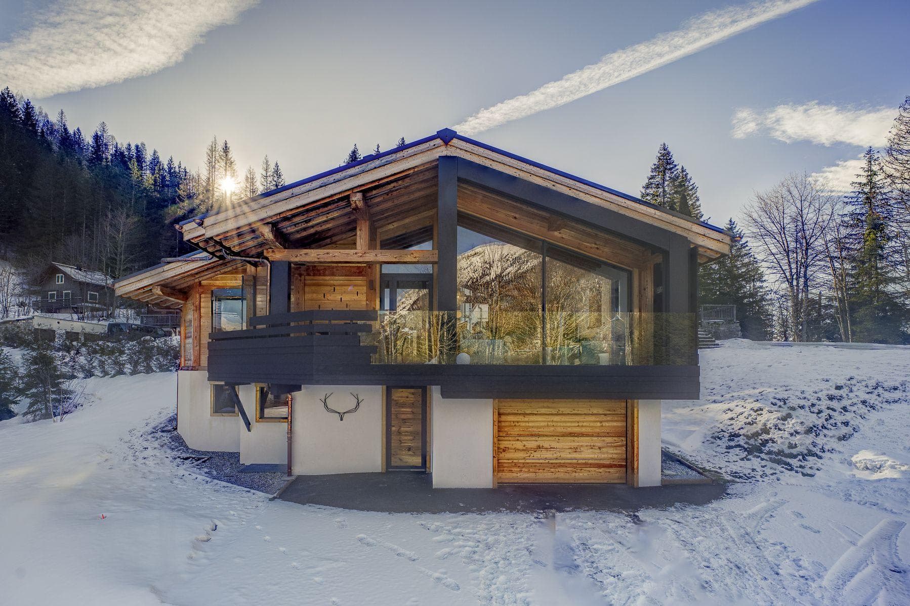 Ski-in/ski-out chalet with heated garage and floor-to-ceiling windows