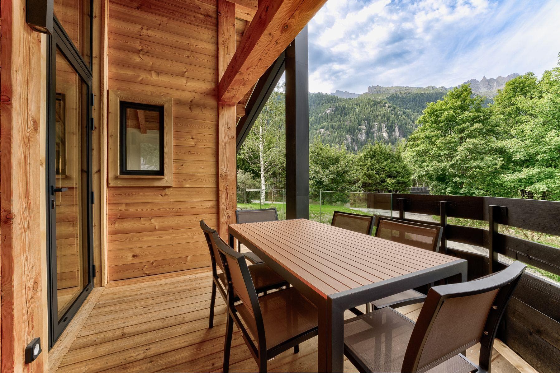 Covered balcony with dining for 6 and mountain views