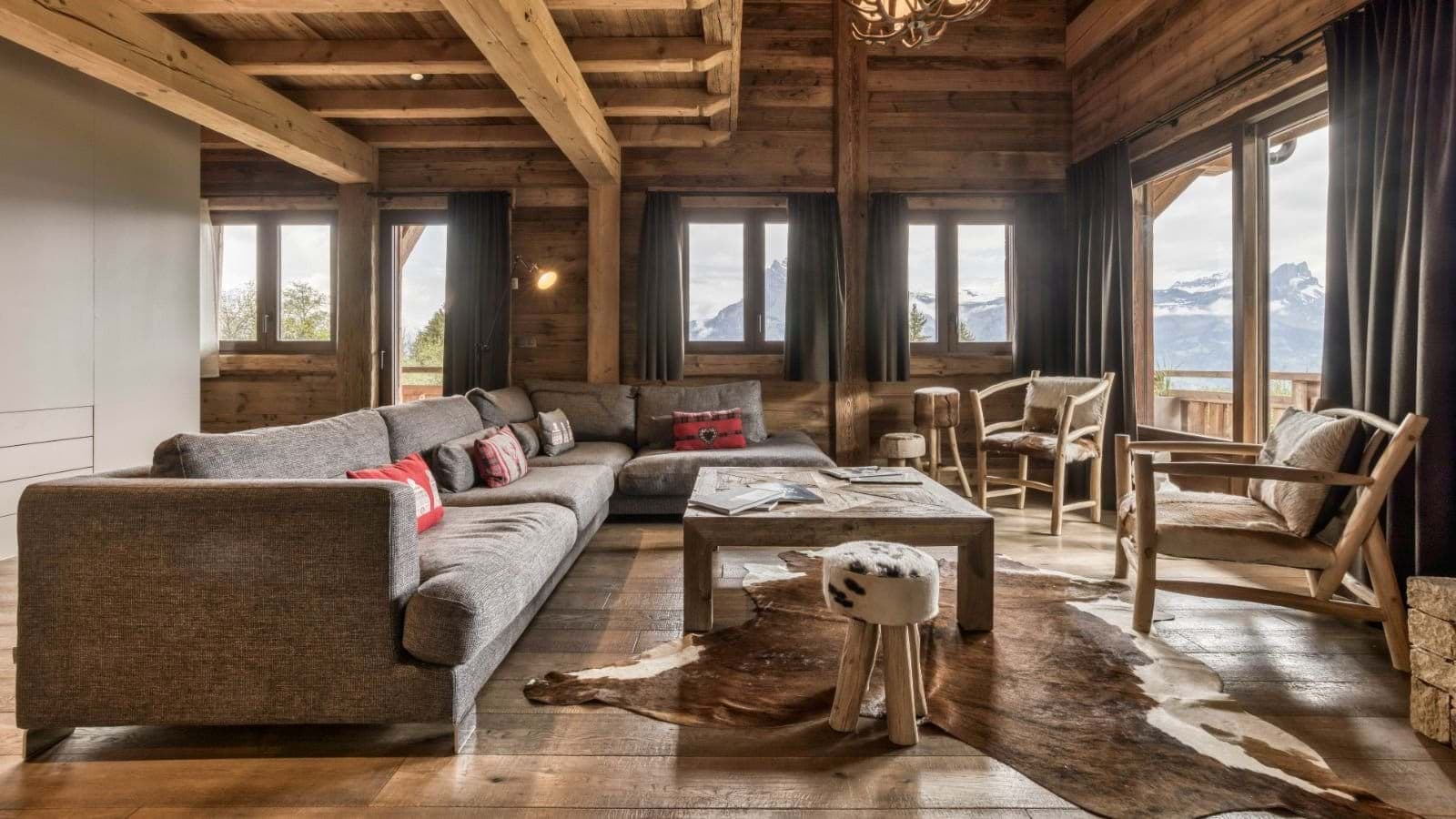 Living area with sectional seating and panoramic Alpine mountain views