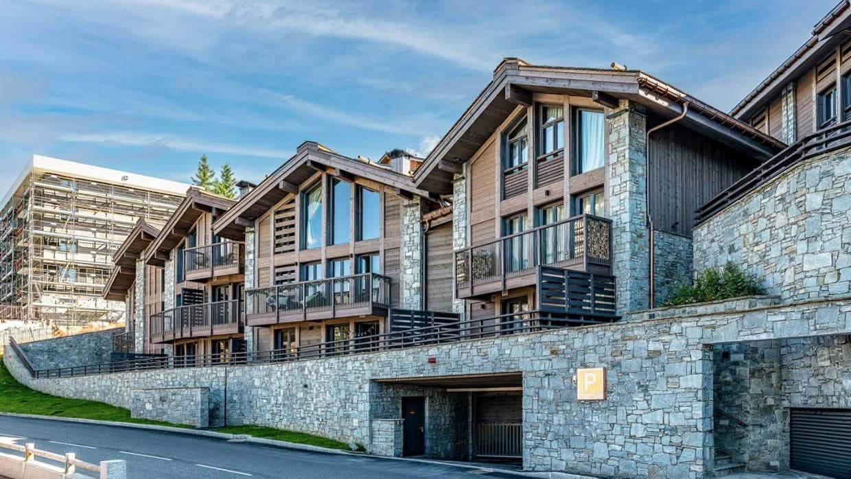 Stone and timber exterior with private balconies and underground parking