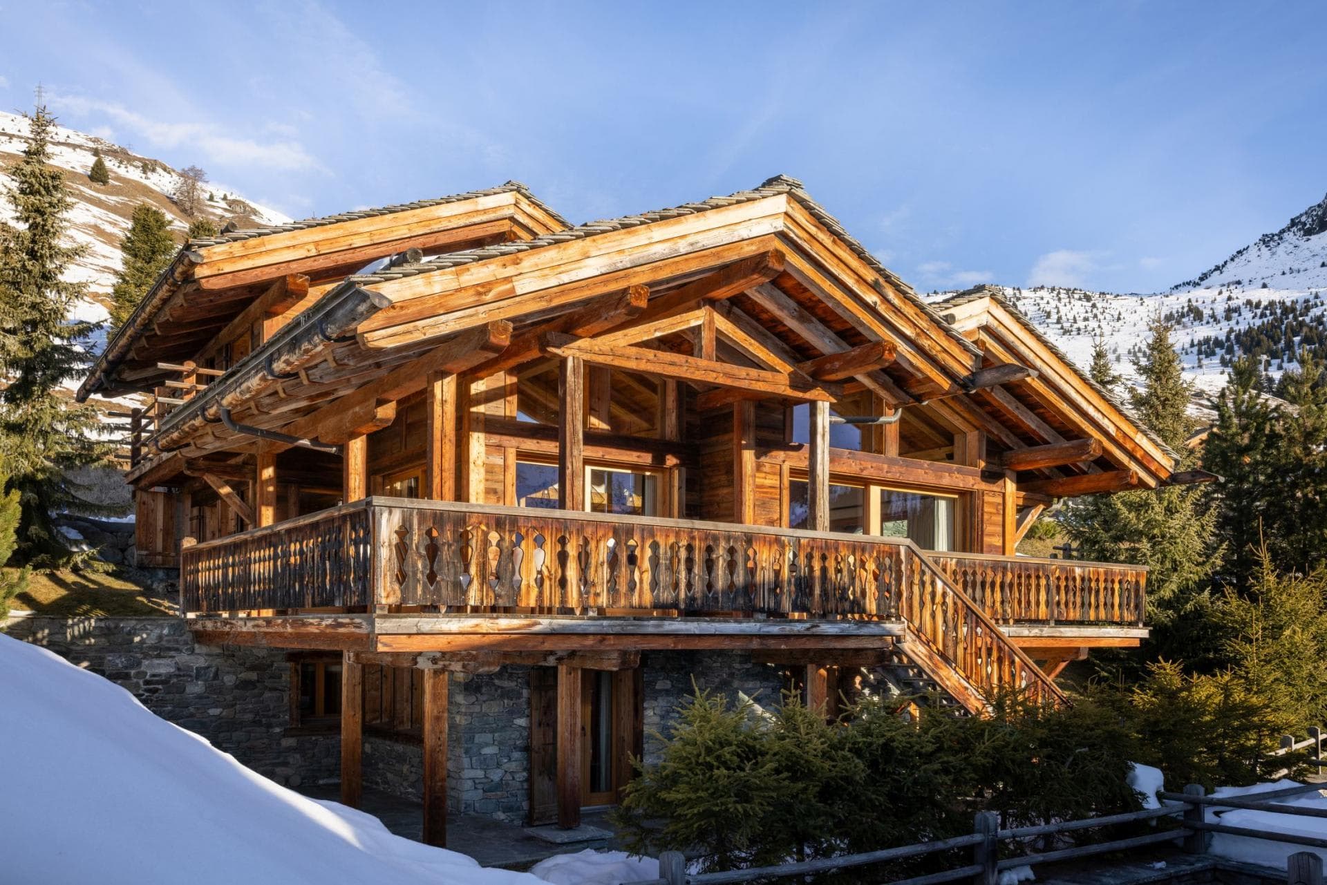 Ski-in/ski-out timber chalet with wrap-around balcony and mountain views