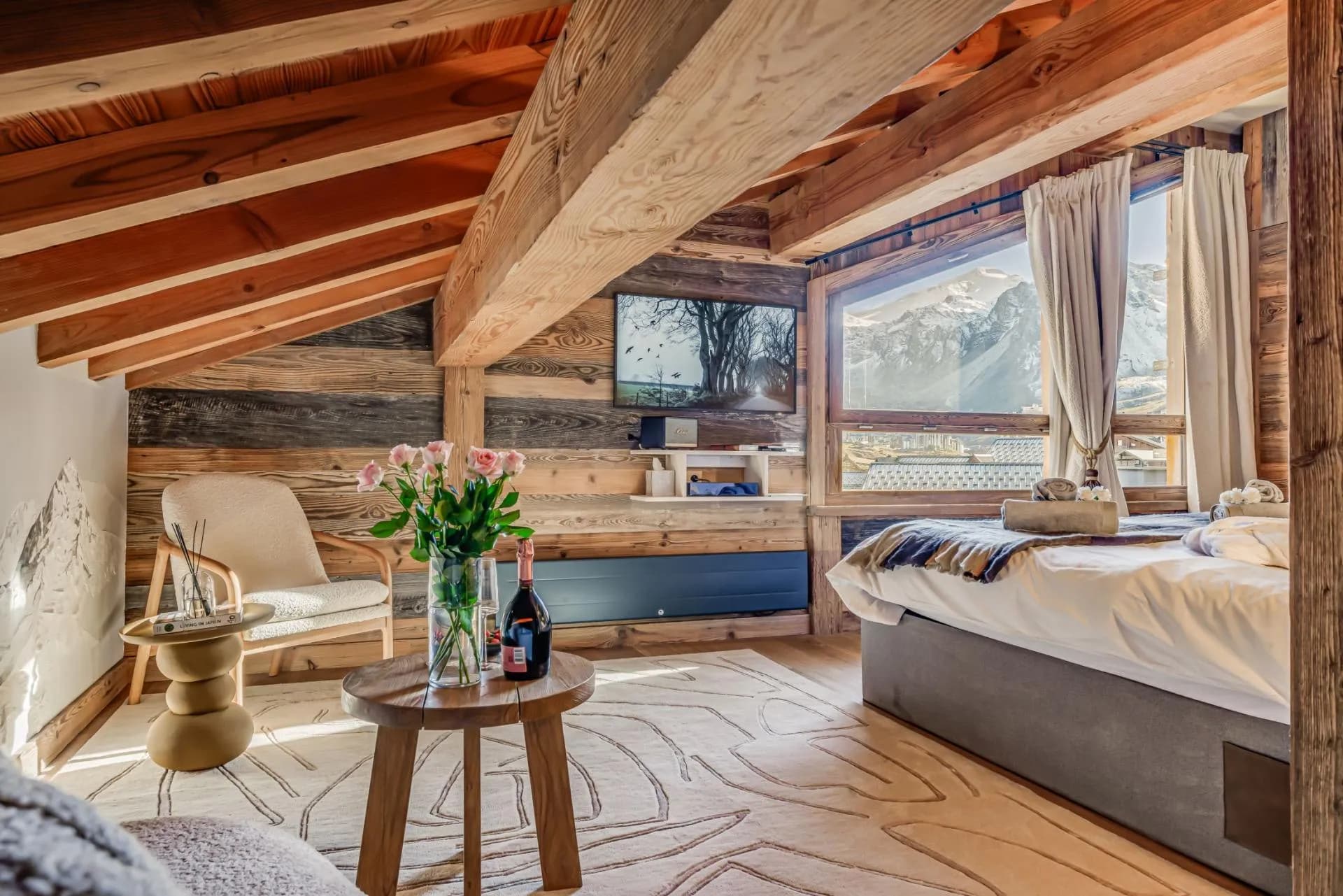 Bedroom featuring vaulted timber ceilings and panoramic mountain views