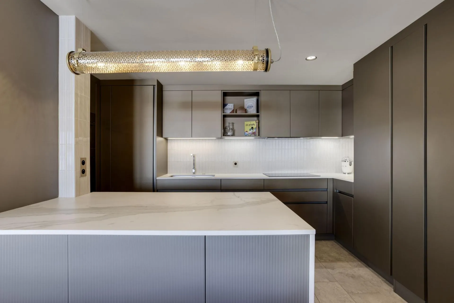 Kitchen with induction cooktop and stone island
